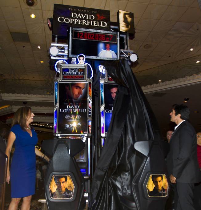 Jean Venneman with Bally and magician David Copperfield unveil his new slot machine at the MGM Grand on Thursday, June 26, 2014.