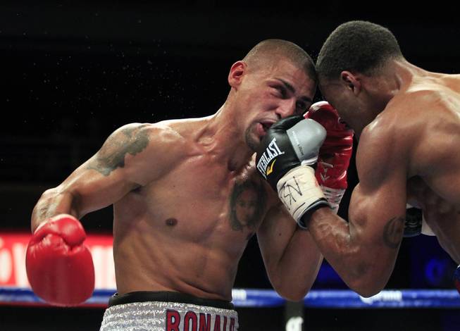 Pennsylvania's Ronald Cruz takes a punch to the face by Errol Spence Jr. as ShoBox: The New Generation on SHOWTIME presents their welterweight fight at the Hard Rock Hotel & Casino on Friday, June 27, 2014.