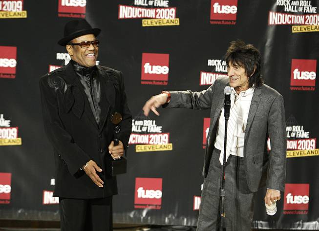 In this April 4, 2009, file photo, Bobby Womack and Ronnie Wood talk backstage after Womack was inducted into the Rock and Roll Hall of Fame at the 2009 Rock and Roll Hall of Fame Induction Ceremony in Cleveland. 