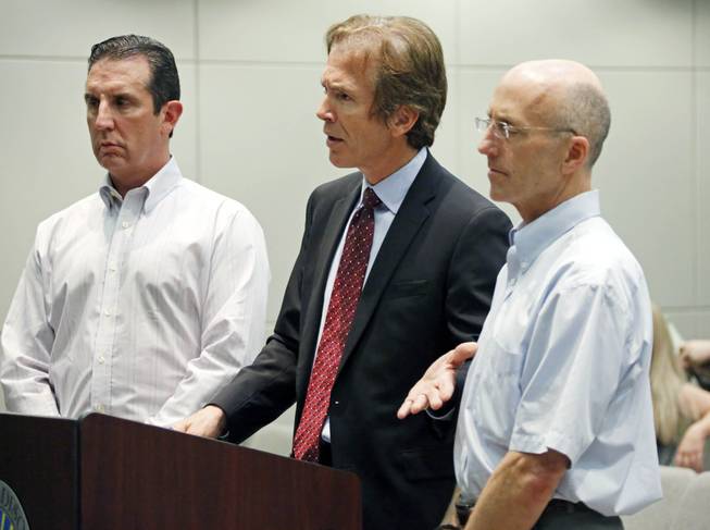 In this May 22, 2014, photograph, Mark Mayfield, right, a member of the board of the Central Mississippi Tea Party, and attorney John Reeves, left, listen as Mayfield's attorney Merrida Coxwell, center, responds to questions from city Judge Dale Danks in Madison, Miss., city court, during an initial court appearance. Mayfield, a tea party official charged with conspiring to take photos of U.S. Sen. Thad Cochran's wife inside a nursing home, apparently committed suicide Friday, June 27, 2014, police said, days after Cochran won a nasty Republican primary.