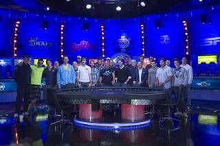 Poker players poses for a photo during opening ceremonies before the start of the Big One for One Drop, a $1,000,000 buy-in No-Limit Hold'em charity poker tournament, at the Rio Sunday, June 26, 2014. The $1 million buy-in is the largest ever for a poker event. Proceeds support One Drop projects in countries experiencing serious difficulties caused by inadequate access to water.