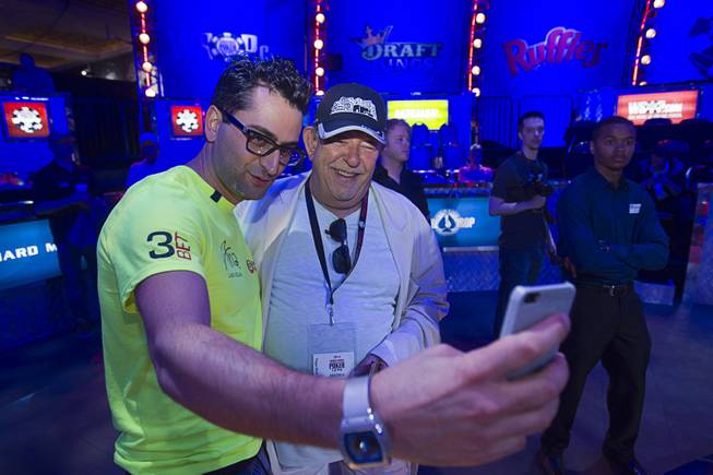 Antonio Esfandiari, the Big Drop for One Drop 2012 champion, takes a selfie with the Las Vegas Sun’s Robin Leach before the start of the Big One for One Drop, a $1 million buy-in No-Limit Hold’em charity poker tournament Sunday, June 26, 2014, at the Rio. The $1 million buy-in is the largest ever for a poker event. Proceeds support One Drop projects in countries experiencing serious difficulties caused by inadequate access to water.