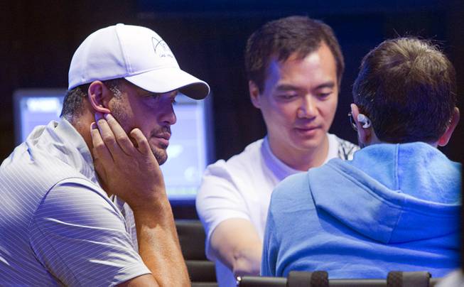 Jean-Robert Bellande, left, competes in the Big One for One Drop, a $1,000,000 buy-in No-Limit Hold'em charity poker tournament, at the Rio Sunday, June 26, 2014. The $1 million buy-in is the largest ever for a poker event. Proceeds support One Drop projects in countries experiencing serious difficulties caused by inadequate access to water.