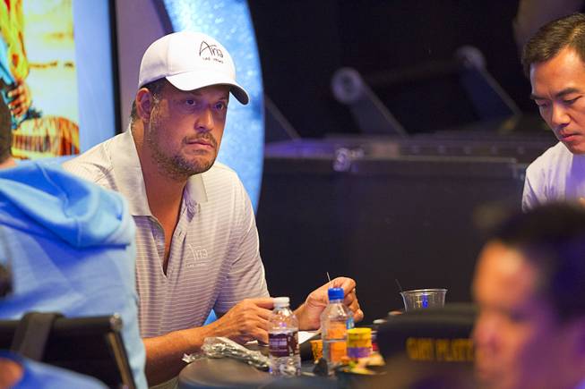 Jean-Robert Bellande waits for play to resume after a break in the Big One for One Drop, a $1,000,000 buy-in No-Limit Hold'em charity poker tournament, at the Rio Sunday, June 26, 2014. The $1 million buy-in is the largest ever for a poker event. Proceeds support One Drop projects in countries experiencing serious difficulties caused by inadequate access to water. 