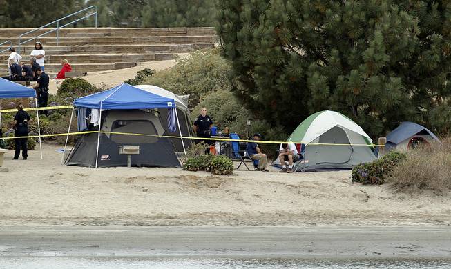 Crime scene tape surrounds tents and campers at the Boy Scout Summer Camp on Fiesta Island Monday, June 30, 2014, after a boy died from a self-inflicted gunshot wound. 