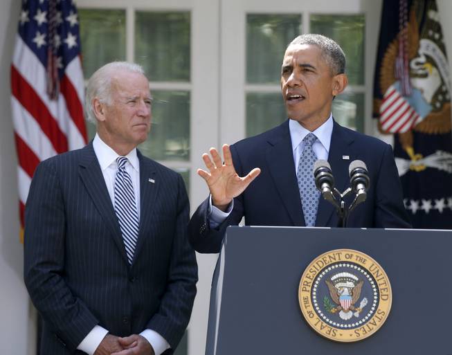 President Barack Obama, accompanied by Vice President Joe Biden, speaks about immigration reform, Monday, June 30, 2014, in the Rose Garden at the White House in Washington.