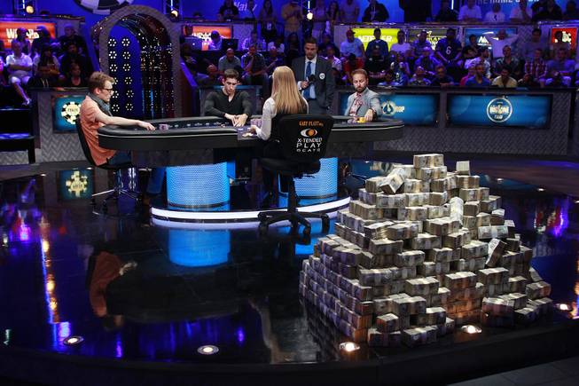 From left, Christoph Vogelsang, Daniel Colman and Daniel Negreanu play during the final table of the Big One For One Drop tournament at the World Series of Poker Tuesday, July 1, 2014 at the Rio. Colman took home first place and $15,306,668 in prize money.