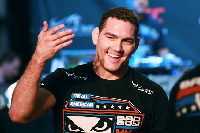 Chris Weidman gestures to fans during the open workout for UFC 175 Wednesday, July 2, 2014 at the Fashion Show Mall.