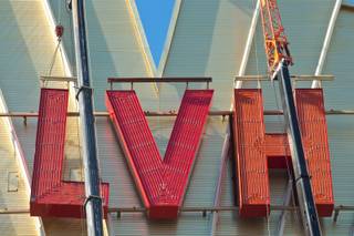 Yesco sets up large cranes in preparation to remove the LVH letters off the main sign of Westgate's newly purchased property, formerly the Las Vegas Hotel, Tuesday July 1, 2014.