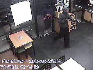A surveillance image shows two black men with guns entering the Subway sandwich shop at 591 College Drive, near Horizon Drive, at around 10 p.m., Tuesday, July 1, 2014.