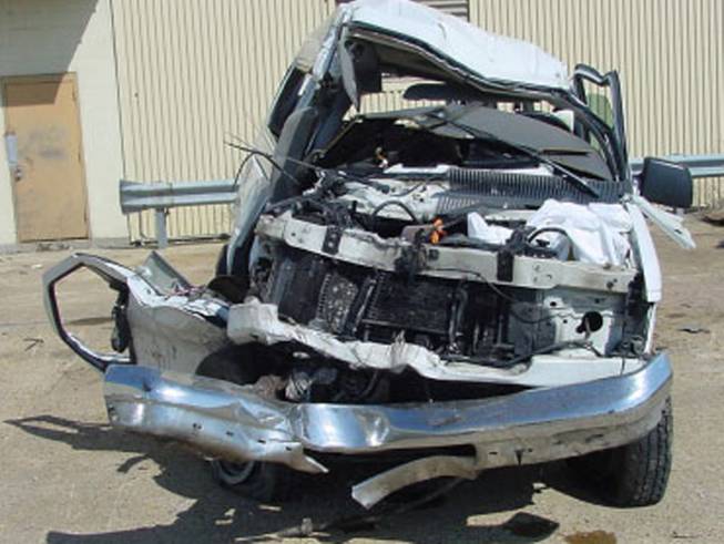 This April 4, 2002, file photo provided by the National Transportation Safety Board shows a 15-passenger "Tippy Toes" day-care bus after it crashed into a bridge killing the driver and four of the six children aboard. The National Transportation Safety Board said the driver fell asleep. The Centers for Disease Control and Prevention released its latest drowsy driving report on Thursday, July 3, 2014. According to a new survey, about 1 in 25 adults say they recently fell asleep while driving.