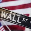 This Aug. 9, 2011, file photo, shows a Wall Street street sign near the New York Stock Exchange, in New York.