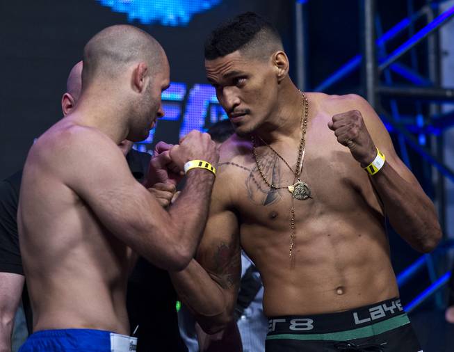 Welterweight Kenny Robertson faces off with opponent  Idlemar Alcantara during the UFC 175 weigh ins at the Mandalay Bay Resort on Friday, July 4, 2014.