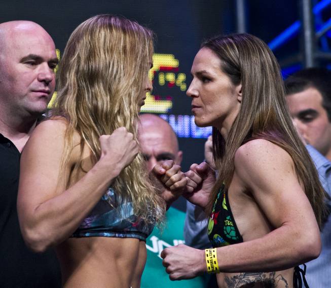 Ronda Rousey and Alexis Davis square off during UFC 175 weigh-ins at the Mandalay Bay on Friday, July 4, 2014.
