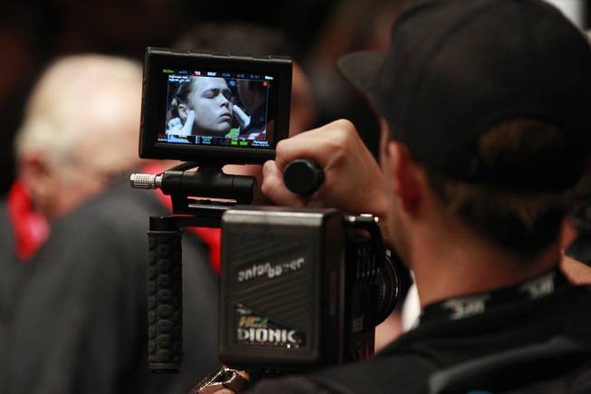 Ronda Rousey appears on a camera monitor as she is prepped for her fight against Alexis Davis during at UFC 175 at the Mandalay Bay Events Center Saturday, July 5, 2014. Rousey retained her title with a 16-second TKO.