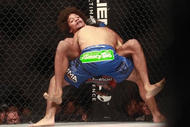Urijah Faber throws Alex Caceres during their fight at UFC 175 at the Mandalay Bay Events Center Saturday, July 5, 2014. Faber won by submission in the third round.