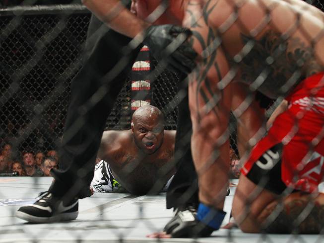 Derrick Lewis stares at Guto Inocente after knocking him out in the first round of their fight at The Ultimate Fighter 19 Finale Sunday, July 6, 2014 at the Mandalay Bay Events Center.