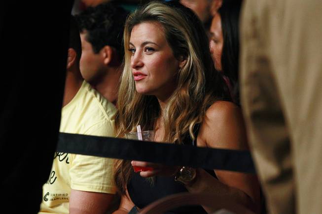 Misha Tate watches the action at "The Ultimate Fighter" 19 finale Sunday, July 6, 2014 at the Mandalay Bay Events Center.