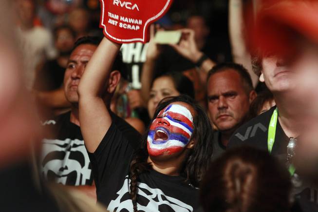 A B.J. Penn fan cheers as he makes his entrance for his  fight against Frankie Edgar at "The Ultimate Fighter" 19 finale Sunday, July 6, 2014 at the Mandalay Bay Events Center.
