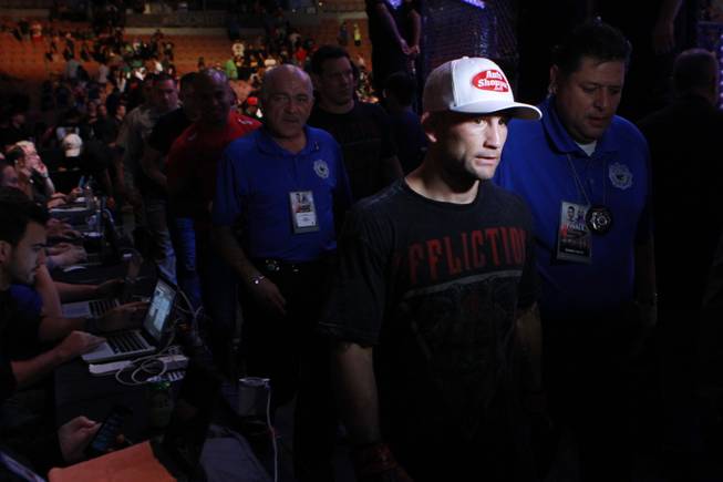 Frankie Edgar exits the arena after notching a third round TKO of B.J. Penn at "The Ultimate Fighter" 19 finale Sunday, July 6, 2014 at the Mandalay Bay Events Center.