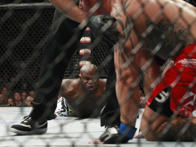 Derrick Lewis stares at Guto Inocente after knocking him out in the first round of their fight at The Ultimate Fighter 19 Finale Sunday, July 19, 2014 at the Mandalay Bay Events Center.