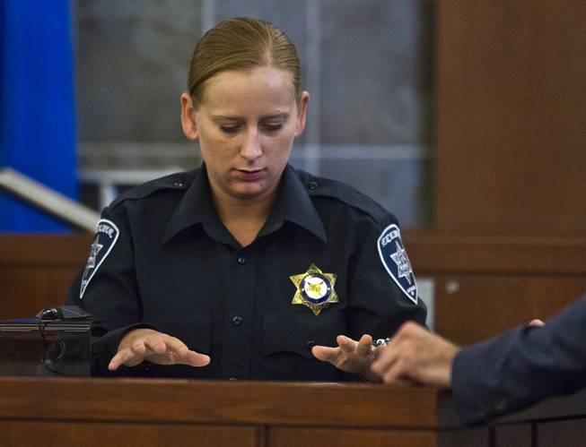Excalibur security officer Kaylynn Kalmback points out on the map where suspect Joey Kadmiri was when she first encountered him as his trial begins Tuesday, July 8, 2014.  He was allegedly beat up by the Thunder From Down Under Male Revue dancers after trying to burglarize their locker room.