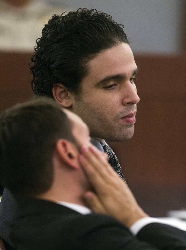 Joey Kadmiri looks to his attorney Joshua Tomshek as his trial begins, he was  allegedly beat up by the Thunder From Down Under Male Revue dancers after trying to burglarize their locker room Tuesday, July 8, 2014.