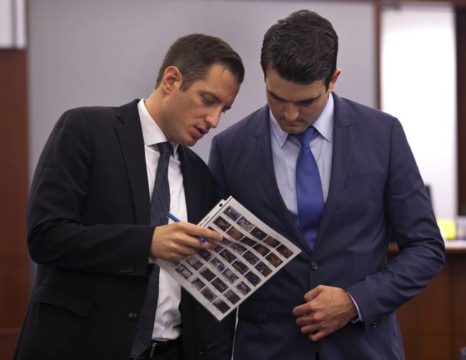 Prosecuting attorneys Jeff Rogan and Kenneth Portz look through evidence information as the Joey Kadmiri trial continues at the Regional Justice Center on  Tuesday, July 8, 2014.