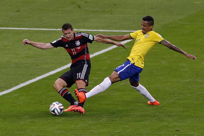 Germany's Miroslav Klose (11) shoots at goal during the World Cup semifinal soccer match between Brazil and Germany at the Mineirao Stadium in Belo Horizonte, Brazil, Tuesday, July 8, 2014.