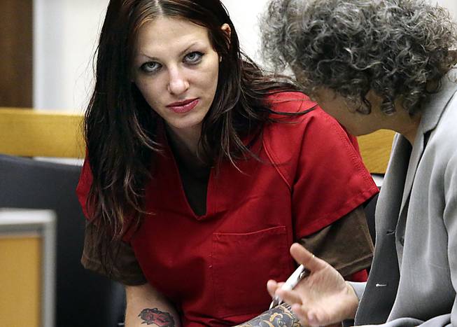 Alix Tichelman, left, of Folsom, Calif., confers with public defender Diane August during her arraignment in Santa Cruz Superior Court Wednesday, July 9, 2014, in Santa Cruz, Calif. Tichelman, an alleged upscale prostitute, is facing manslaughter charges in the November 2013 death of Forrest Hayes, a Google executive.