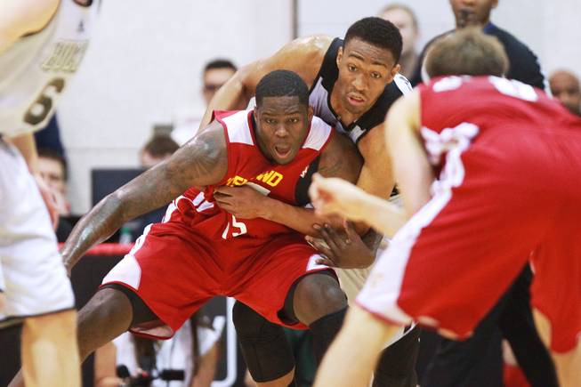 Cleveland forward Anthony Bennett and Milwaukee forward Chris Wright fight for position during their NBA Summer League game Friday, July 11, 2014 at the Cox Pavilion.