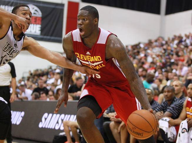 Cleveland forward Anthony Bennett is guarded by Milwaukee forward Jabari Parker during their NBA Summer League game Friday, July 11, 2014 at the Cox Pavilion.