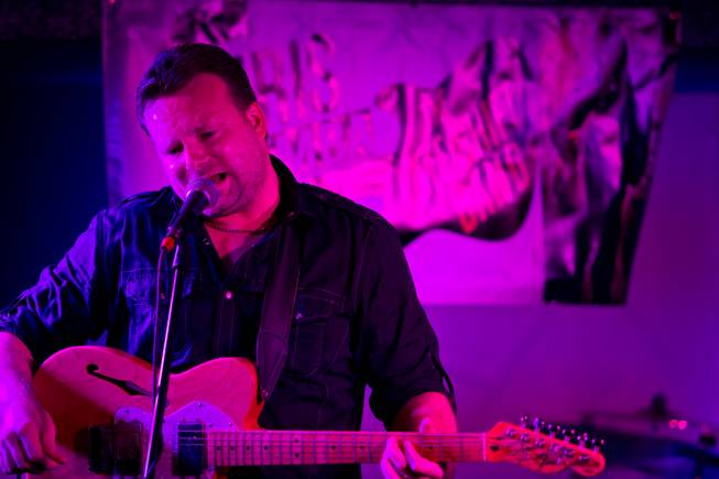 Chris Zemba, of Chris Zemba and the Late Shift Band, rocks the house at the Sand Dollar Lounge during their reopening party, Thursday July 10, 2014.