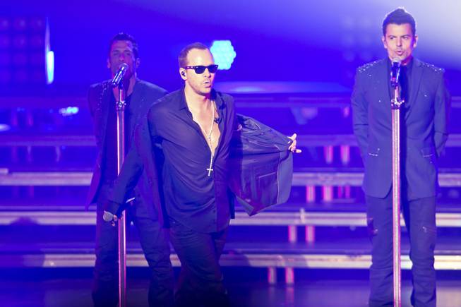 Danny Wood, Donnie Wahlberg and Jordan Knight of New Kids on the Block perform in the Axis at Planet Hollywood on Thursday, July 10, 2014.