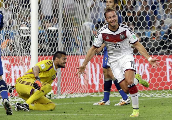 Germany's Mario Gotze celebrates after scoring the opening goal during the World Cup final soccer match between Germany and Argentina at the Maracana Stadium in Rio de Janeiro, Brazil, Sunday, July 13, 2014. Germany won 1-0 to win the World Cup.