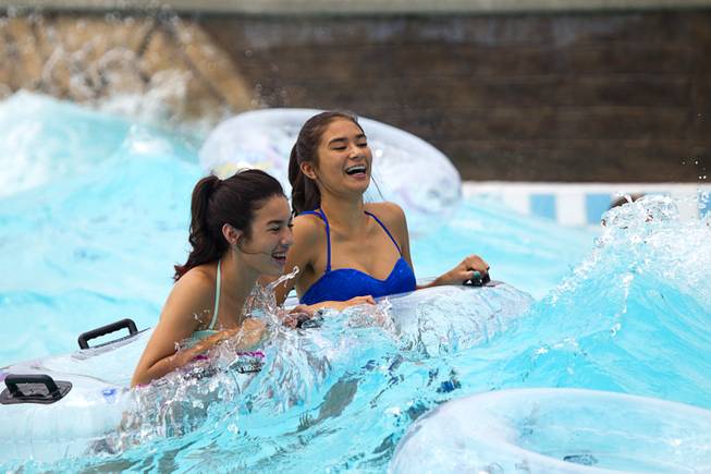 Teens enjoy a wave pool at the Cowbunga Bay water park in Henderson Monday, July 14, 2014.