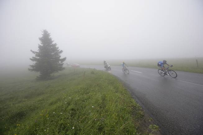 Jan Barta of the Czech Republic, right, and Netherlands' Lieuwe Westra during the tenth stage of the Tour de France cycling race over 161.5 kilometers (100.4 miles) with start in Mulhouse and finish in La Planche des Belles Filles, France, Monday, July 14, 2014. 