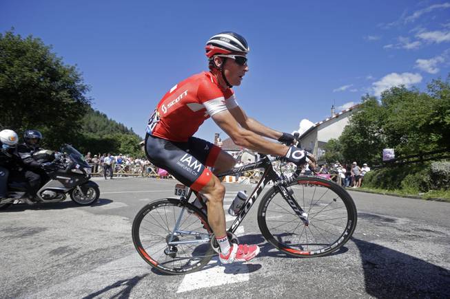 Switzerland's Martin Elmiger climbs in the breakaway during the eleventh stage of the Tour de France cycling race over 187.5 kilometers (116.5 miles) with start in Besancon and finish in Oyonnax, France, Wednesday, July 16, 2014. 