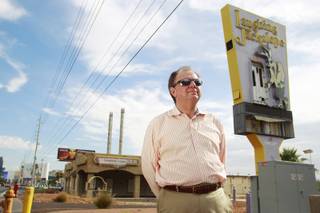 Real estate broker Ric Truesdell is seen outside the shuttered Laughing Jackalope on the south end of the Strip Tuesday, July 15, 2014.