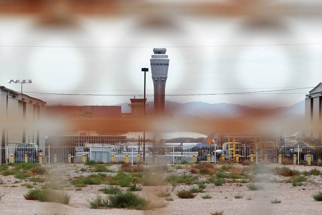 The new McCarran International Airport control tower is seen through a fence on the south end of the Strip Tuesday, July 15, 2014.