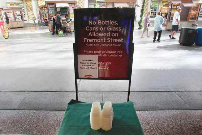 A sign at Binion's advises patrons that bottles and cans are not allowed at the Fremont Street Experience Thursday, July 17, 2014.