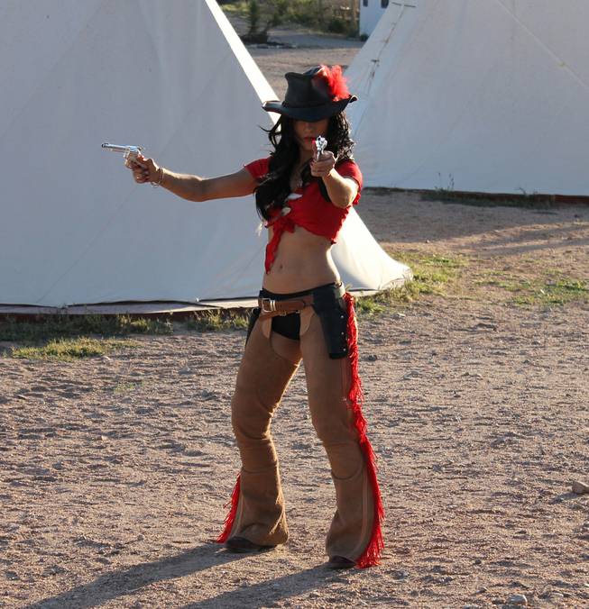 Melody Sweets fires away during the video shoot for Sweets' "Shoot 'em Up" at Grand Canyon Ranch on April 22, 2014.
