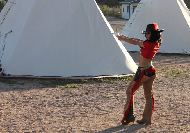 Holding the pose is Melody Sweets during the video shoot for Sweets' "Shoot 'em Up" at Grand Canyon Ranch on April 22, 2014.