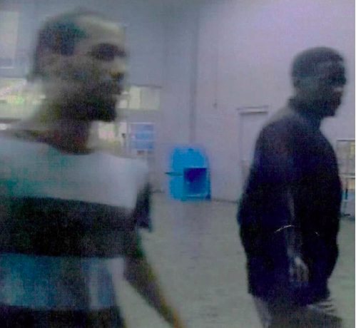 Police say these two men robbed a woman of her purse in a parking lot July 3.