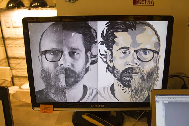 A composite photo and artwork based on photographer Todd Duane Miller, left side, and artist JW Caldwell is displayed on a computer monitor in the P3 Studio in the Cosmopolitan Monday, July 21, 2014. For their project, Miller combines portraits of people and Caldwell creates artwork from the composite photos.