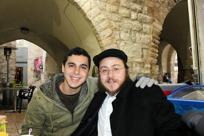 This 2012 photo provided by Rabbi Asher Hecht, shows Nissim Sean Carmeli, left, with Hecht in Jerusalem. The Israel Defense Forces said Sunday, July 20, 2014, in a statement that Carmeli was killed in combat in the Gaza Strip. Carmeli was from South Padre Island, Texas, said Deputy Consul General of Israel to the Southwest Maya Kadosh.