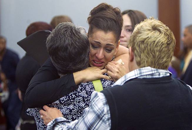 Celeste Flores Narvaez, older sister of Deborah Flores Narvaez, hugs her mother after Jason Griffith was sentenced to life in prison during sentencing at the Regional Justice Center Wednesday, July 23, 2014. The former Las Vegas Strip performer was found guilty of second-degree murder in the 2010 death and dismemberment of his ex-girlfriend Deborah Flores Narvaez, a dancer in Luxor's topless "Fantasy" revue.