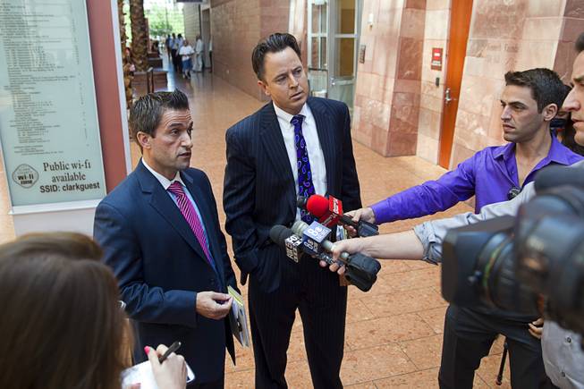 Abel Yanez, left, and Jeff Banks, defense attorneys for Jason Griffith, speak to reporters after  Griffith was sentenced to life in prison at the Regional Justice Center Wednesday, July 23, 2014. The former Las Vegas Strip performer was found guilty of second-degree murder in the 2010 death and dismemberment of his ex-girlfriend Deborah Flores Narvaez, a dancer in Luxor's topless "Fantasy" revue.