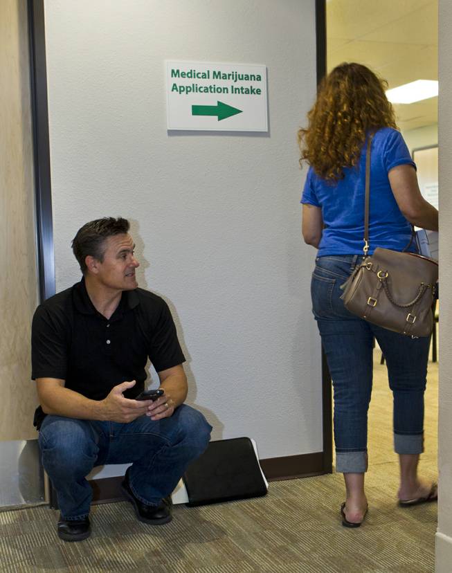 Tony Ricco joins others in waiting to be processed on the  last day to submit applications to the Las Vegas Department of Planning for medical marijuana dispensaries, cultivation or production on Wednesday, July 23, 2014.