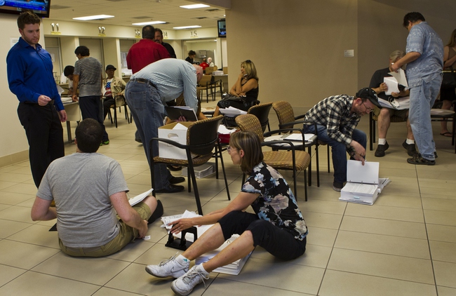 Applicants gather to be processed as today is the last day to submit applications to the Las Vegas Department of Planning for medical marijuana dispensaries, cultivation or production on Wednesday, July 23, 2014.